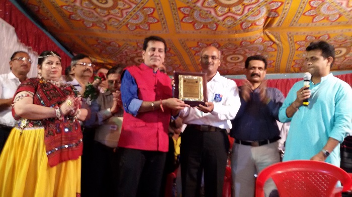 Felicitating Businessman by Vocational Excellence Award for his contribution to society.